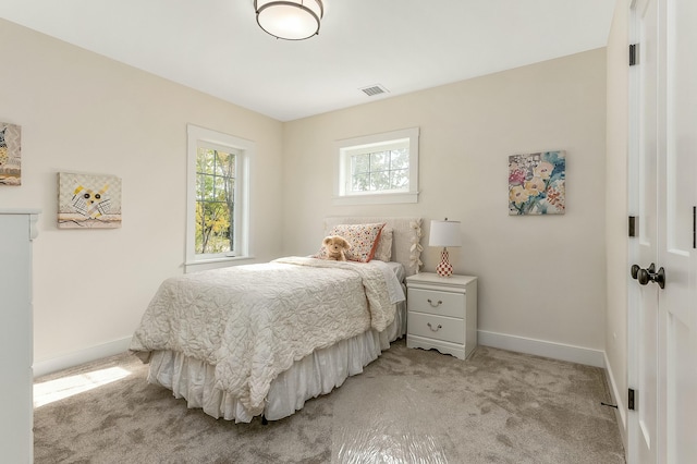 37 Cascade Cir Unit 26, Kennebunk, ME 04043 - bedroom with visible vents, baseboards, and light carpet