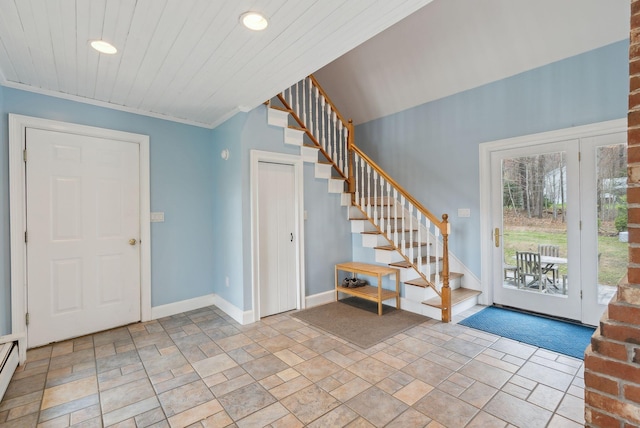 entrance foyer with recessed lighting, stairs, and stone finish floor