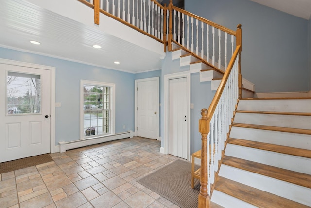 foyer entrance featuring recessed lighting, baseboards, a baseboard heating unit, and stairway