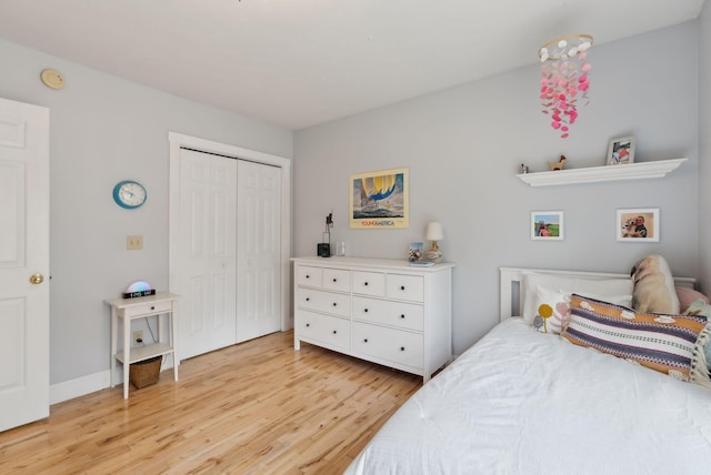 bedroom featuring a closet and light wood-type flooring