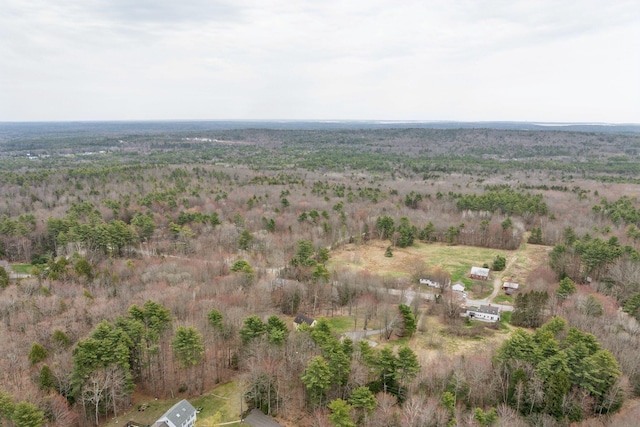 drone / aerial view featuring a view of trees