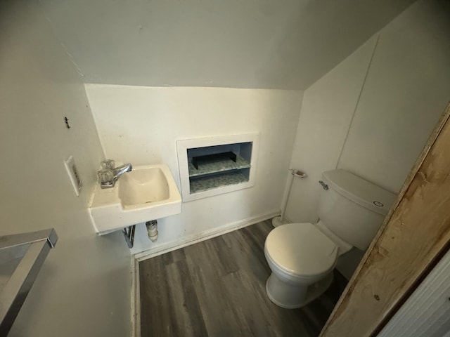 334 Main St, Madawaska, ME 04756 - half bathroom with toilet, wood finished floors, and a sink