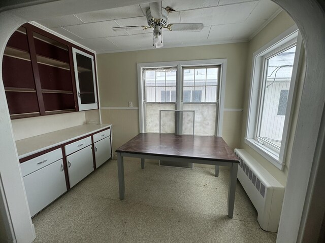 334 Main St, Madawaska, ME 04756 - unfurnished office featuring radiator, ceiling fan, and arched walkways