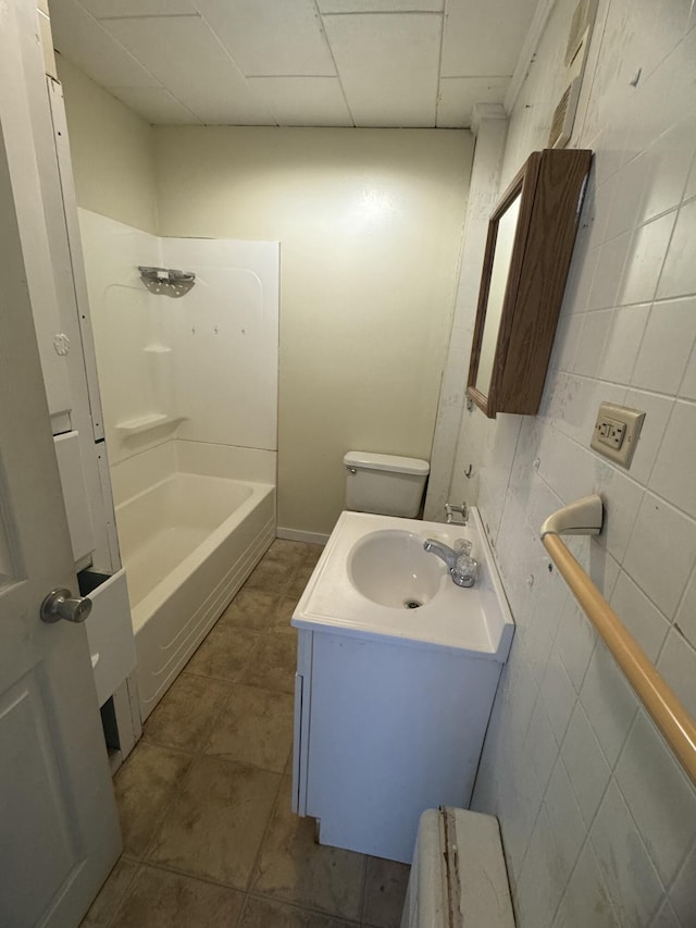 334 Main St, Madawaska, ME 04756 - bathroom with vanity, tile patterned floors, and shower / washtub combination