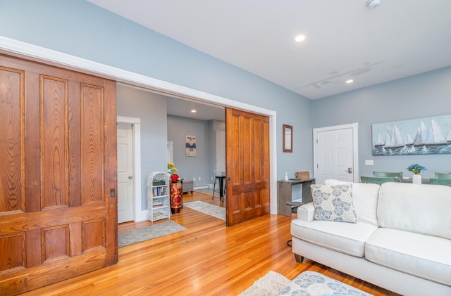 living room with recessed lighting and light wood finished floors