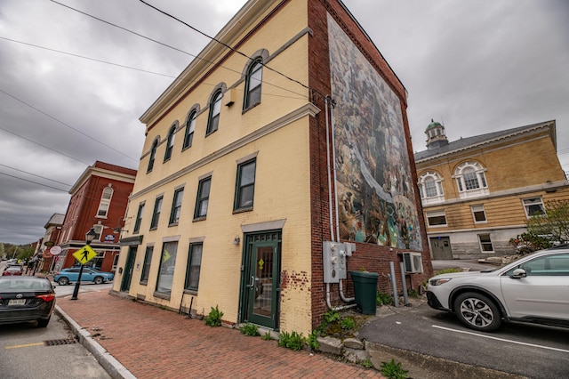 view of property featuring uncovered parking
