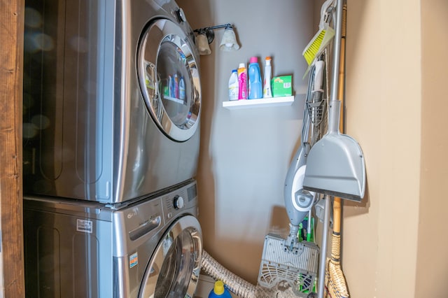laundry room with stacked washing maching and dryer and laundry area