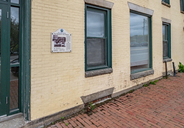 view of property exterior featuring brick siding