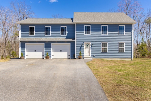 64 Rolling Brook Rd, Raymond, ME 04071 - view of front of property featuring a garage, aphalt driveway, and a front yard