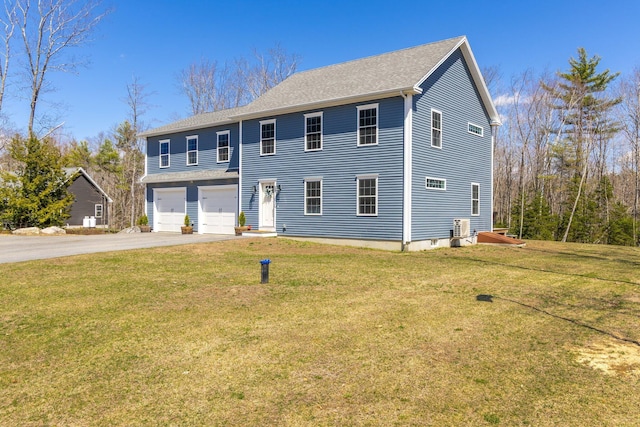 64 Rolling Brook Rd, Raymond, ME 04071 - colonial inspired home with a front lawn, concrete driveway, and an attached garage