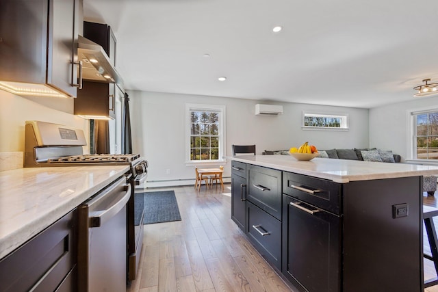 64 Rolling Brook Rd, Raymond, ME 04071 - kitchen featuring a wall mounted AC, stainless steel appliances, open floor plan, baseboard heating, and wood finished floors