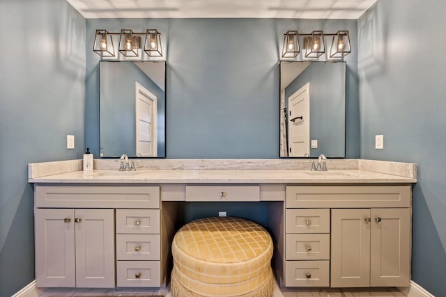 64 Rolling Brook Rd, Raymond, ME 04071 - full bath featuring double vanity, baseboards, and a sink