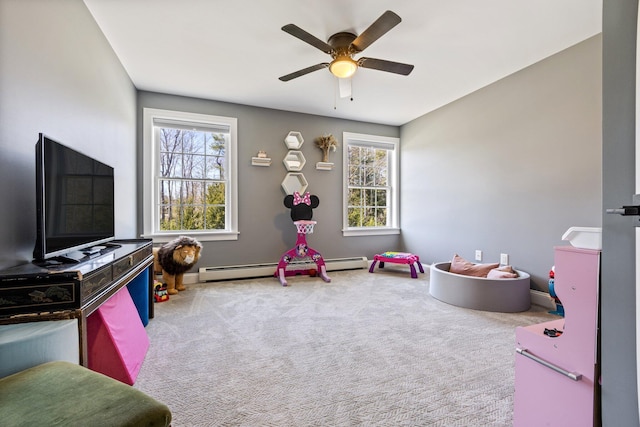 64 Rolling Brook Rd, Raymond, ME 04071 - game room featuring carpet flooring, ceiling fan, baseboard heating, and a healthy amount of sunlight