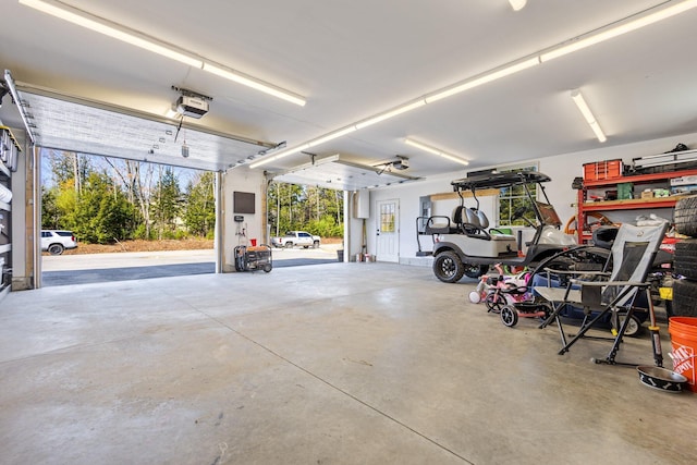 64 Rolling Brook Rd, Raymond, ME 04071 - garage featuring a garage door opener