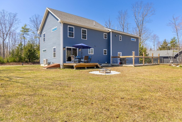 64 Rolling Brook Rd, Raymond, ME 04071 - back of house with a wooden deck, a yard, and a fire pit