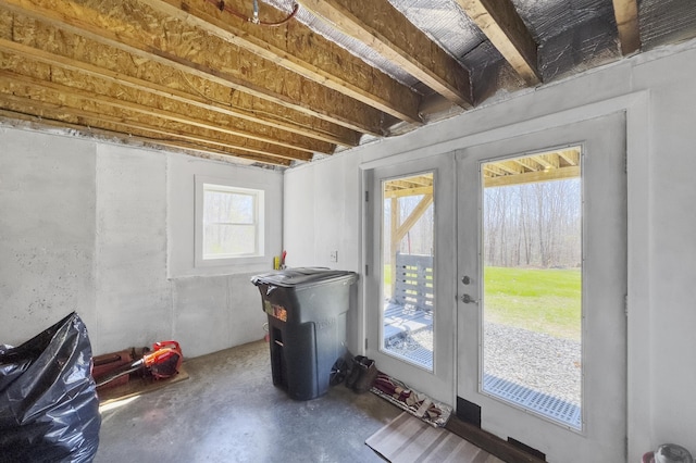 entryway featuring concrete flooring and french doors