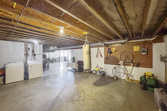 below grade area with separate washer and dryer and electric panel