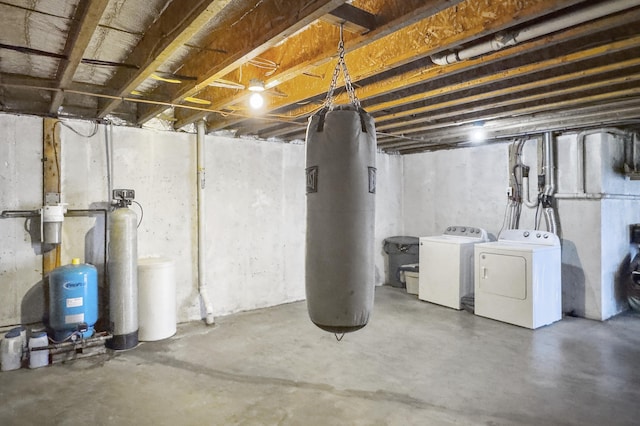 unfinished basement with washing machine and dryer