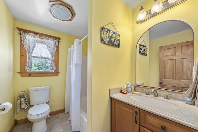 full bath with baseboards, shower / bath combo with shower curtain, toilet, vanity, and tile patterned flooring