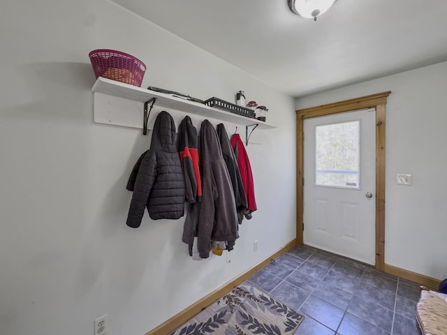 mudroom with baseboards and tile patterned flooring