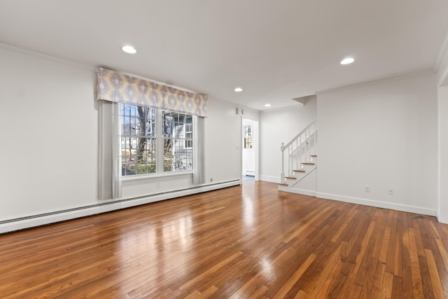unfurnished living room featuring recessed lighting, baseboard heating, stairs, crown molding, and hardwood / wood-style floors