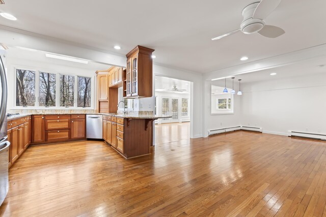 kitchen with baseboard heating, stainless steel dishwasher, a ceiling fan, light wood-style flooring, and light stone countertops