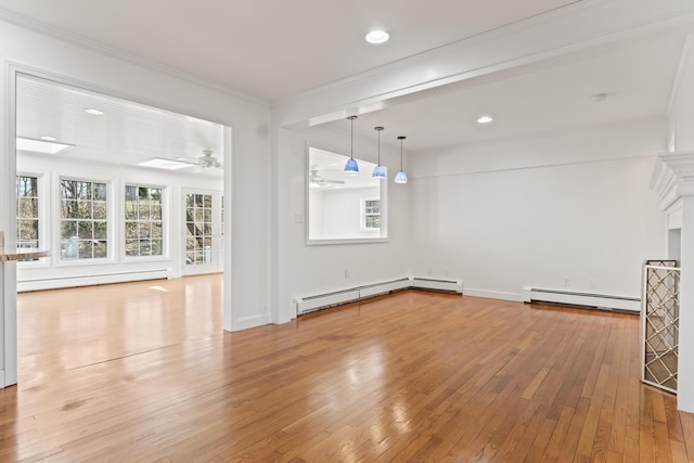unfurnished dining area featuring a baseboard radiator, light wood-style floors, a ceiling fan, and a baseboard heating unit