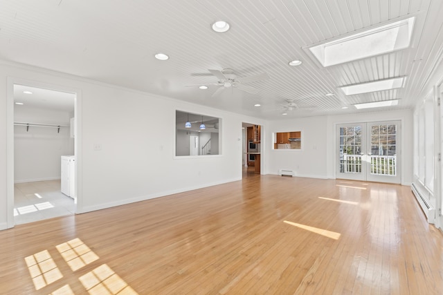 unfurnished living room with a baseboard radiator, light wood finished floors, a ceiling fan, and recessed lighting