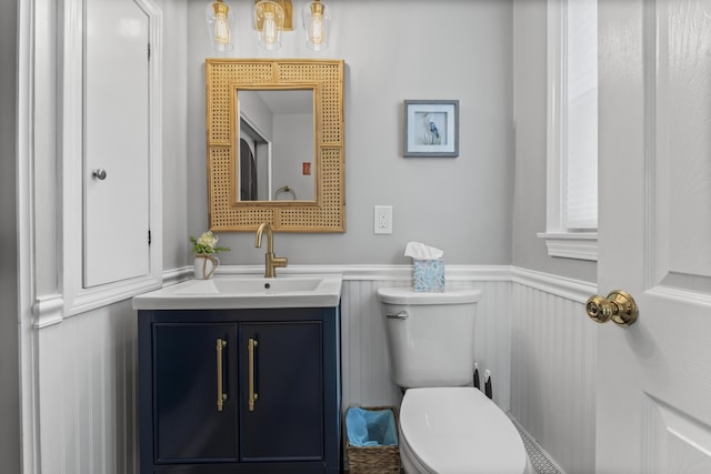 175 Beach Ave Unit 2, Kennebunk, ME 04043 - bathroom with wainscoting, vanity, and toilet