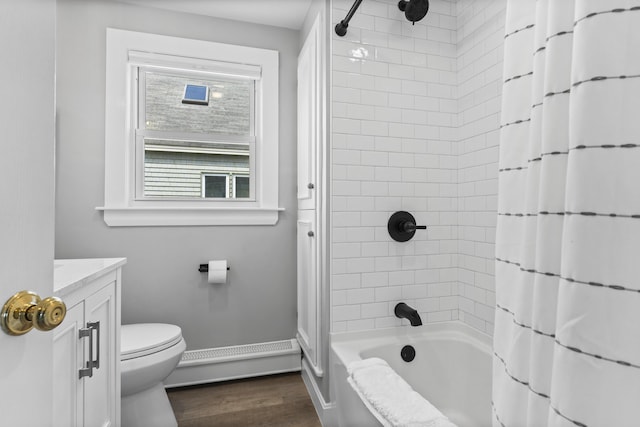 175 Beach Ave Unit 2, Kennebunk, ME 04043 - bathroom featuring baseboard heating, wood finished floors, vanity, toilet, and shower / bath combo with shower curtain