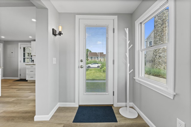 175 Beach Ave Unit 2, Kennebunk, ME 04043 - doorway to outside featuring recessed lighting, wood finished floors, and baseboards
