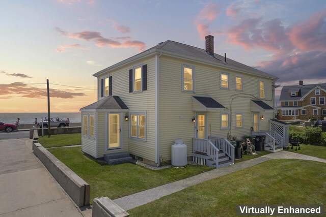 175 Beach Ave Unit 2, Kennebunk, ME 04043 - exterior space featuring a chimney, a water view, and a yard