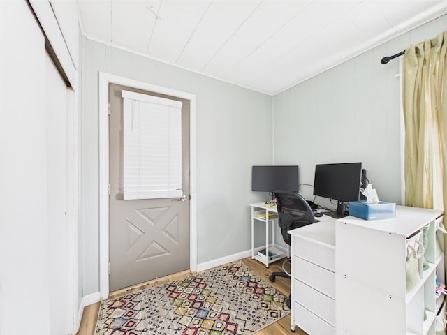home office featuring light wood finished floors and baseboards