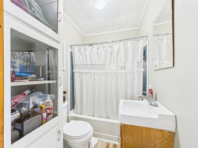 bathroom with vanity, toilet, ornamental molding, shower / tub combo with curtain, and wood finished floors