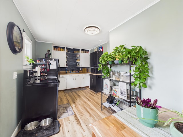kitchen featuring crown molding, white cabinets, open shelves, and light wood-style floors