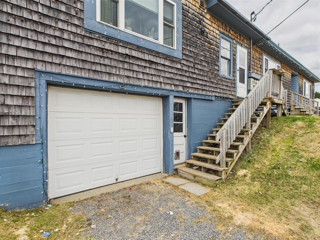 view of side of property featuring aphalt driveway