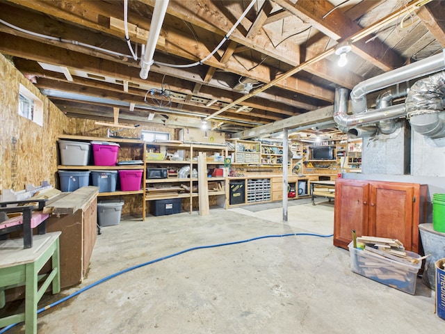 unfinished below grade area featuring a workshop area