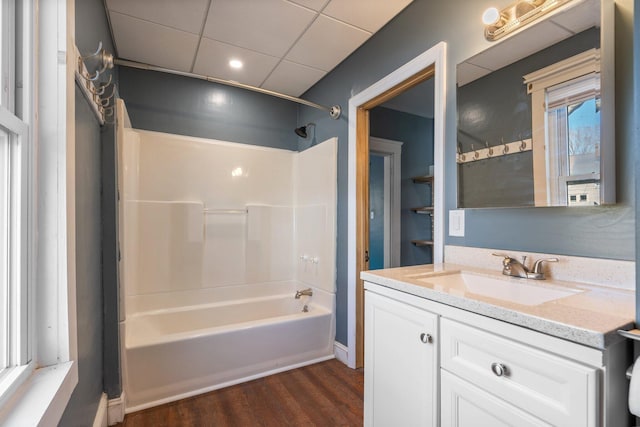 full bath featuring shower / bathing tub combination, wood finished floors, and vanity
