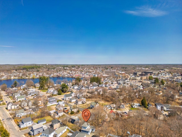 birds eye view of property with a residential view and a water view