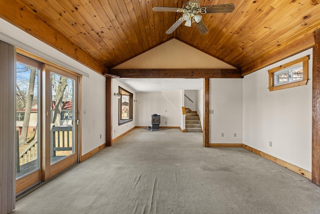 interior space featuring stairway, carpet floors, lofted ceiling, and baseboards