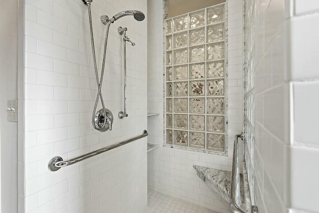 full bath with a tile shower