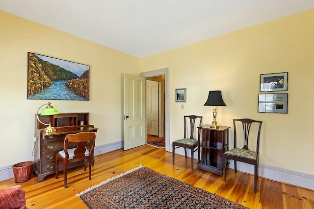 sitting room featuring wood finished floors and baseboards
