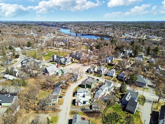 drone / aerial view with a water view and a residential view