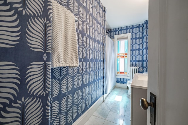 bathroom with wallpapered walls, toilet, marble finish floor, baseboards, and vanity