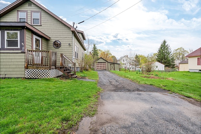 30 Munroe St, Bangor, ME 04401 - view of property exterior featuring driveway, a lawn, and an outbuilding