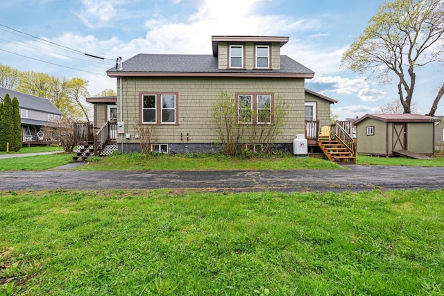 30 Munroe St, Bangor, ME 04401 - view of front facade with a front yard and roof with shingles