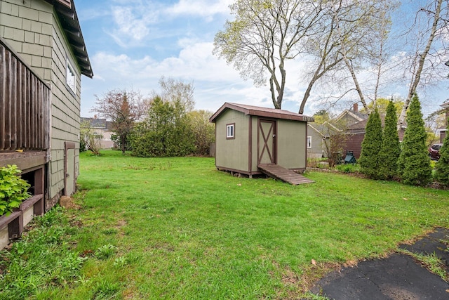 30 Munroe St, Bangor, ME 04401 - view of green lawn with a shed and an outdoor structure