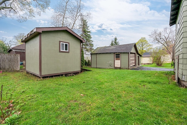 30 Munroe St, Bangor, ME 04401 - view of green lawn with an outdoor structure and a garage