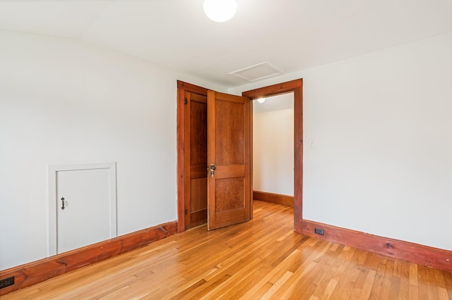 30 Munroe St, Bangor, ME 04401 - empty room featuring attic access, baseboards, and light wood-style floors