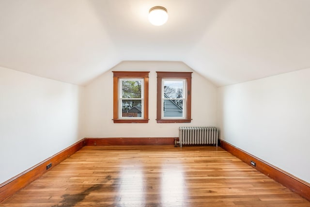 30 Munroe St, Bangor, ME 04401 - bonus room featuring radiator, light wood-type flooring, lofted ceiling, and baseboards